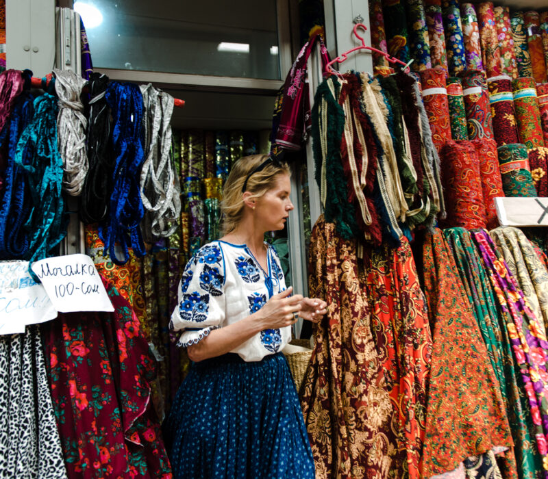 Alexandra Tolstoy buying textiles in Bishkek market