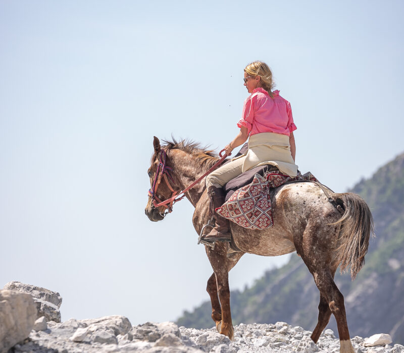 Alexandra riding on horse Tolstoy Travel luxury bespoke horse riding holidays